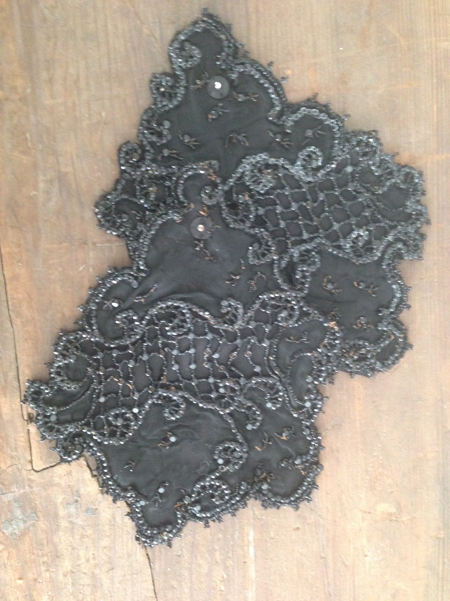 Black faille with beading in shape of applique
