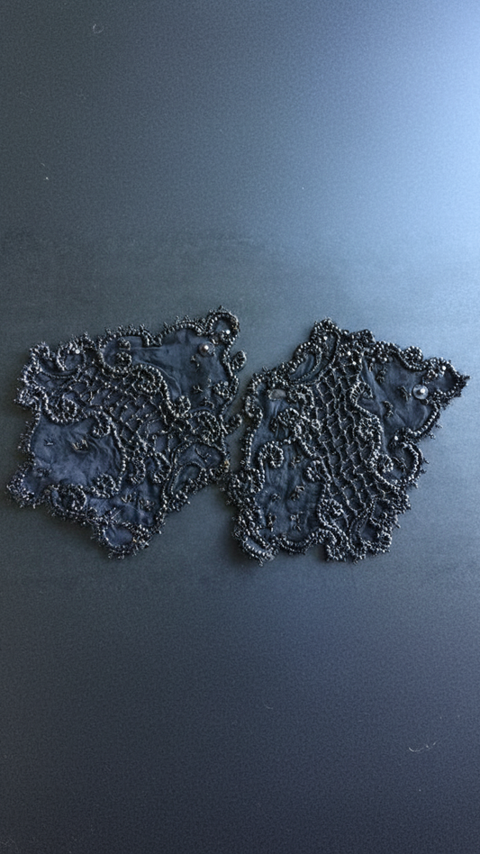 Black faille with beading in shape of applique